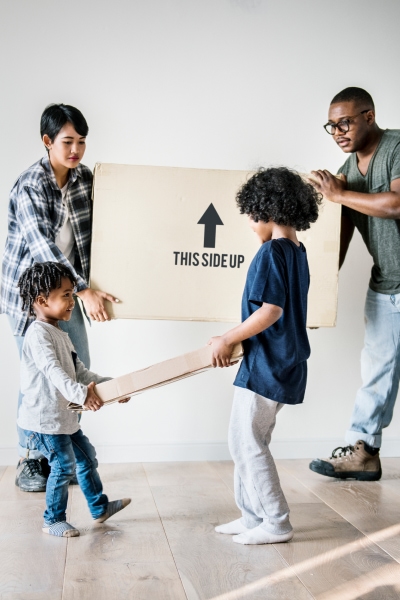 Family moving boxes together