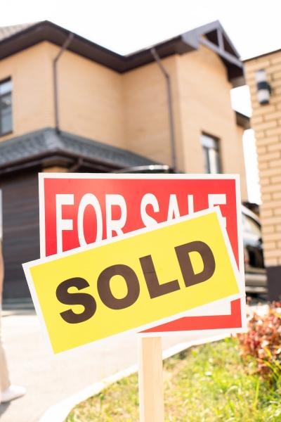 Sold sign in front of home
