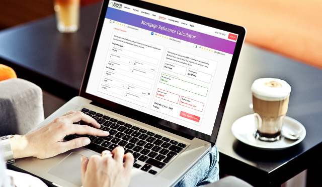 Person calculating a mortgage refinance