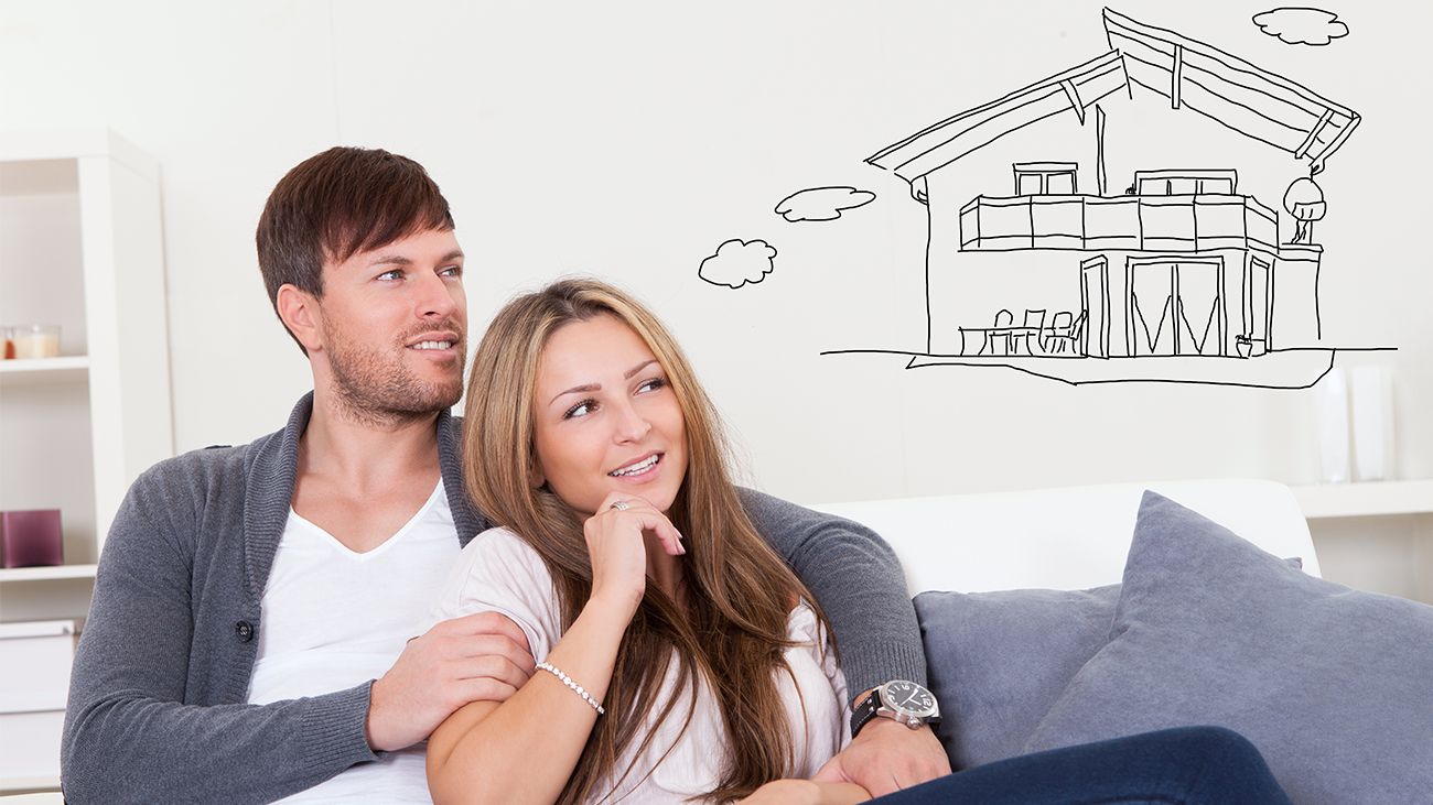 Couple on couch thinking about a home refinance