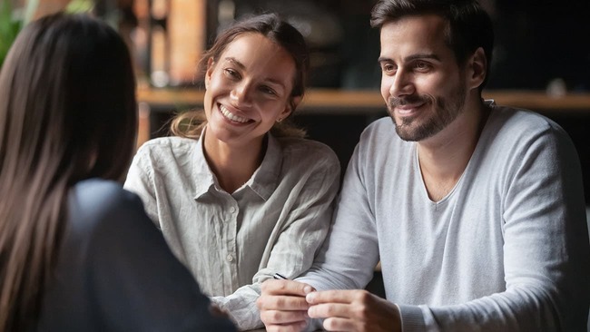 Young couple meeting with mortgage lender