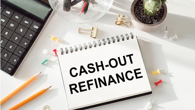 'Cash-out refinance' note on desk with calculator