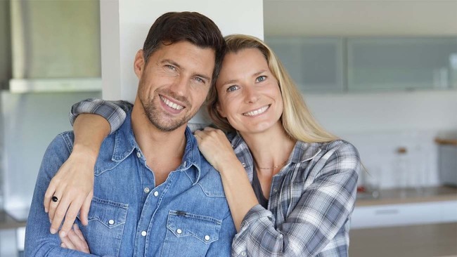 Happy middle-aged couple in kitchen