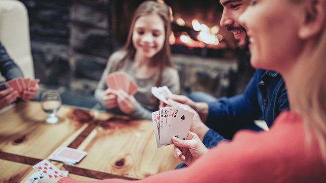 Family playing cards at home