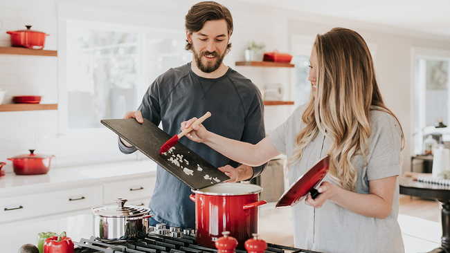 Man and woman cooking in kitchen