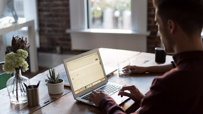 Man working on a laptop in an office