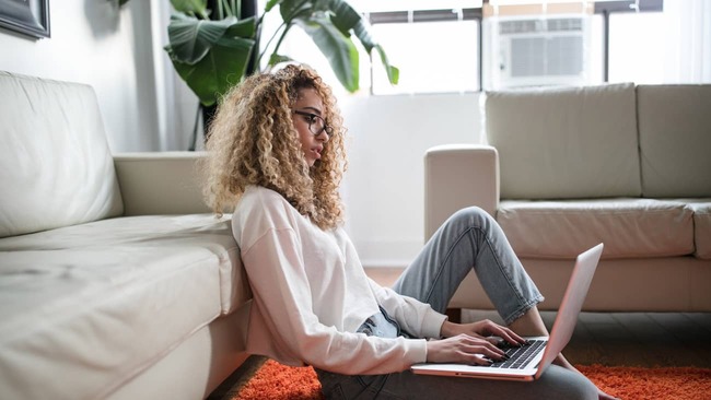 Woman is applying for a home loan on her laptop computer.