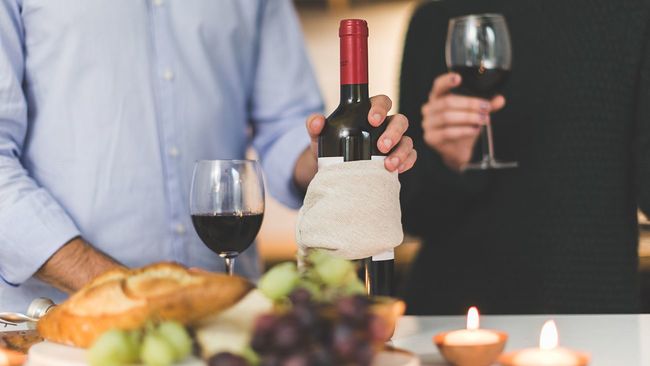 Couple with wine having a date night at home