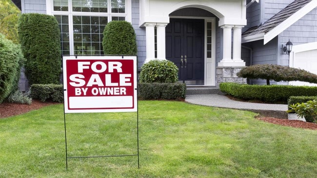 For sale by owner sign in yard