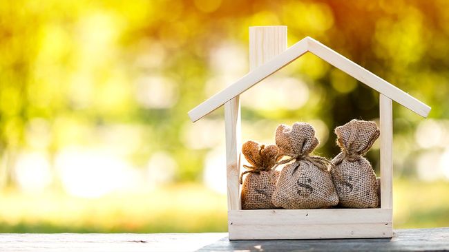 Home equity bags inside small wooden house