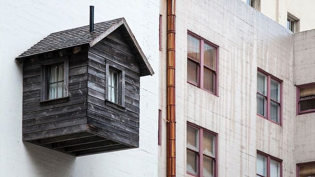 Small home mistakenly built on wall
