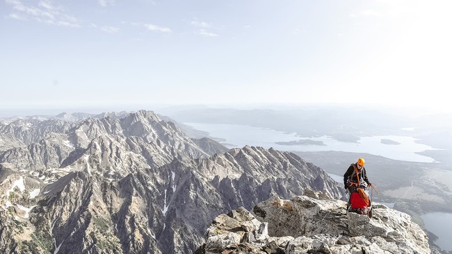 Two people on top of mountain
