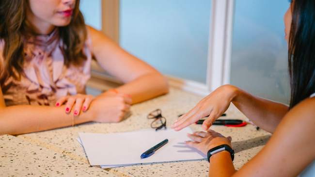 Lender discussing recasting versus refinancing