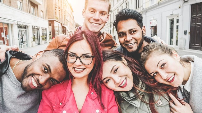 Group of millennial friends smiling