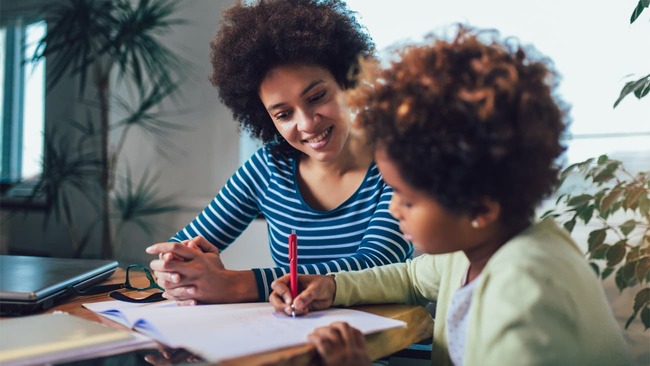 Mom helping child with homework
