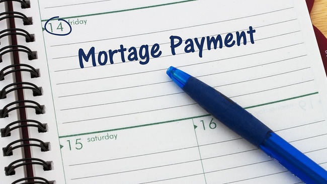 Planner with blue pen and Mortgage Payment text