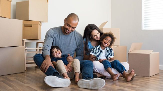 Family with two young children moving into new home.