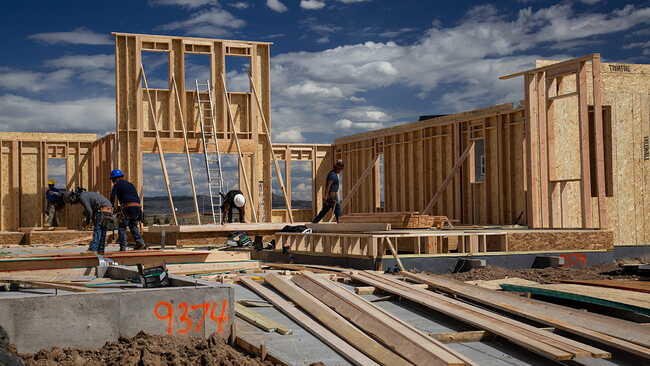 Construction crew building a home