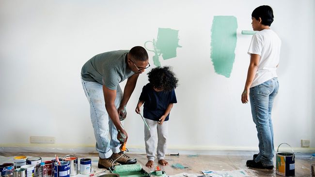 Family painting the interior of their home