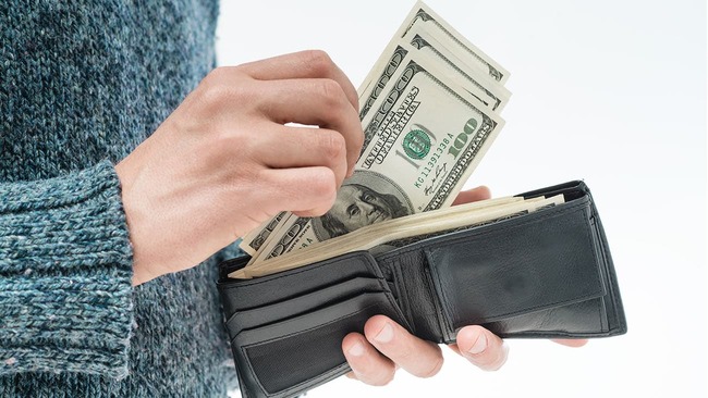 Putting money in wallet