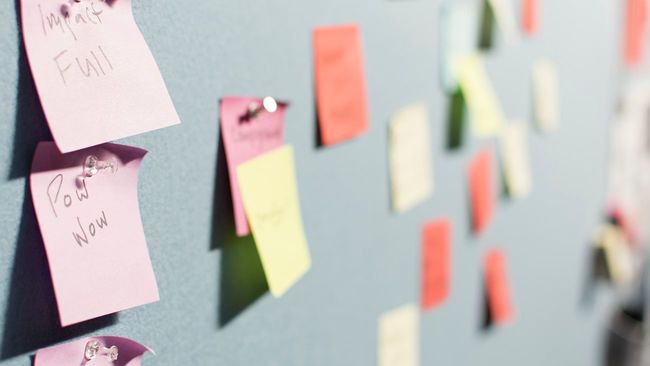 Sticky note reminders on board