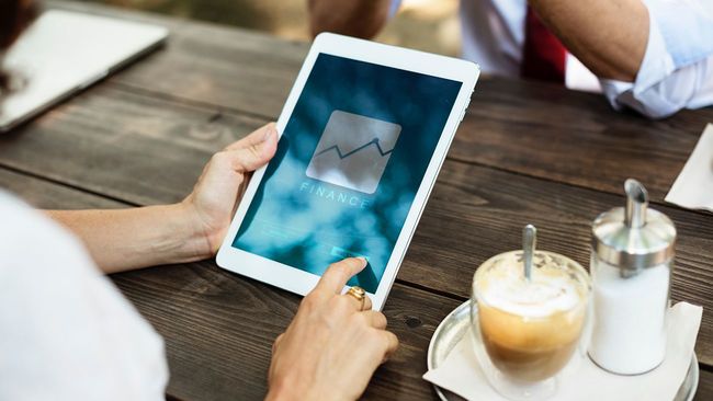 Woman using tablet to research a mortgage