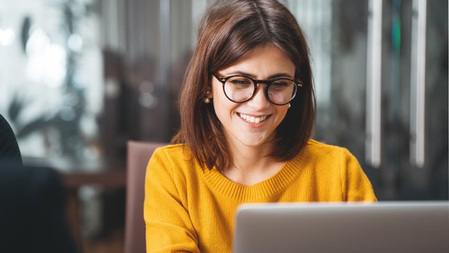 Woman working on laptop in office